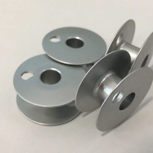 Canilla para máquina plana de dos agujas