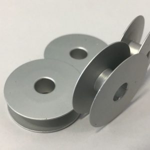 Canilla para máquina de ojales
